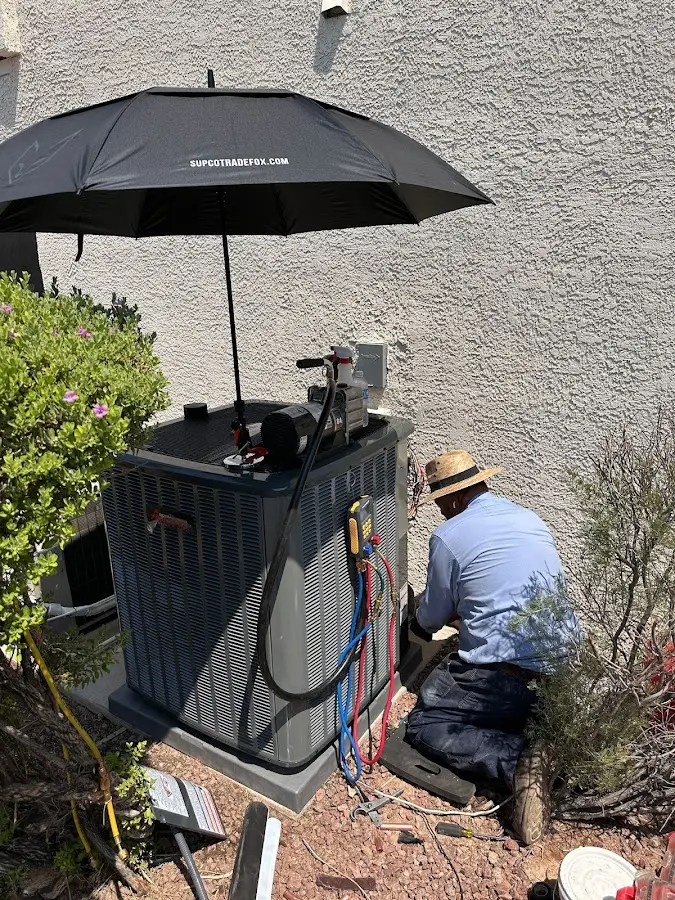 HVAC technician performing outdoor AC maintenance in Rosemead